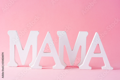 Mama word on pink background. Mother's Day concept