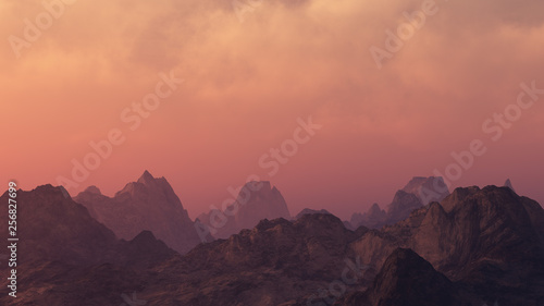 Peaky mountain landscape at cloudy sunset.