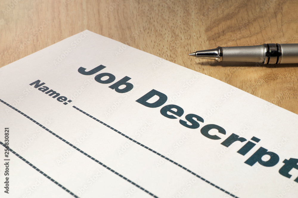Obraz premium Job Description with Pen on the table close up..