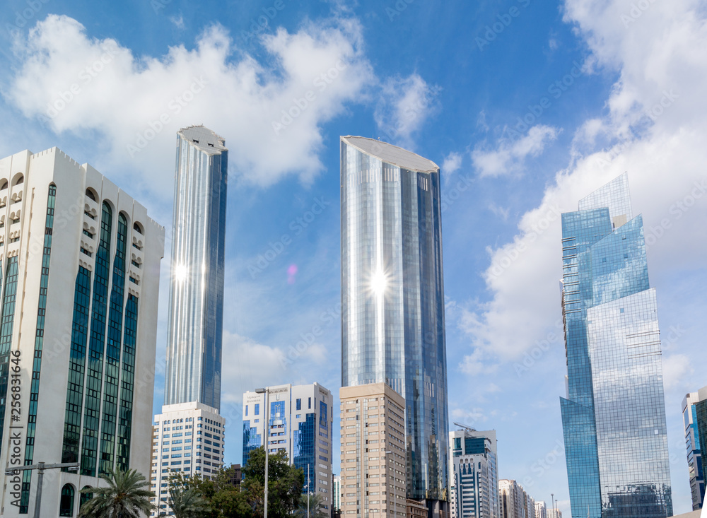 Modern city architecture and famous skyscrapers of Abu Dhabi skyline with beautiful clouds, World Trade Center UAE 