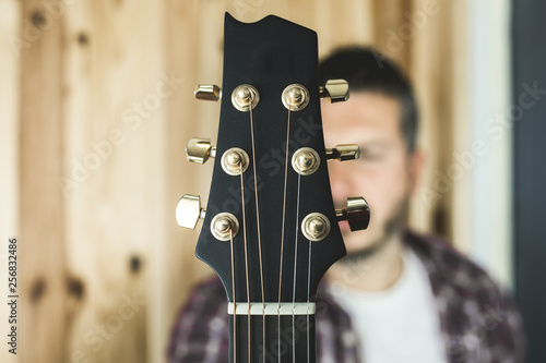 Photos Detail of a headstock of a classical guitar. Music and guitarist