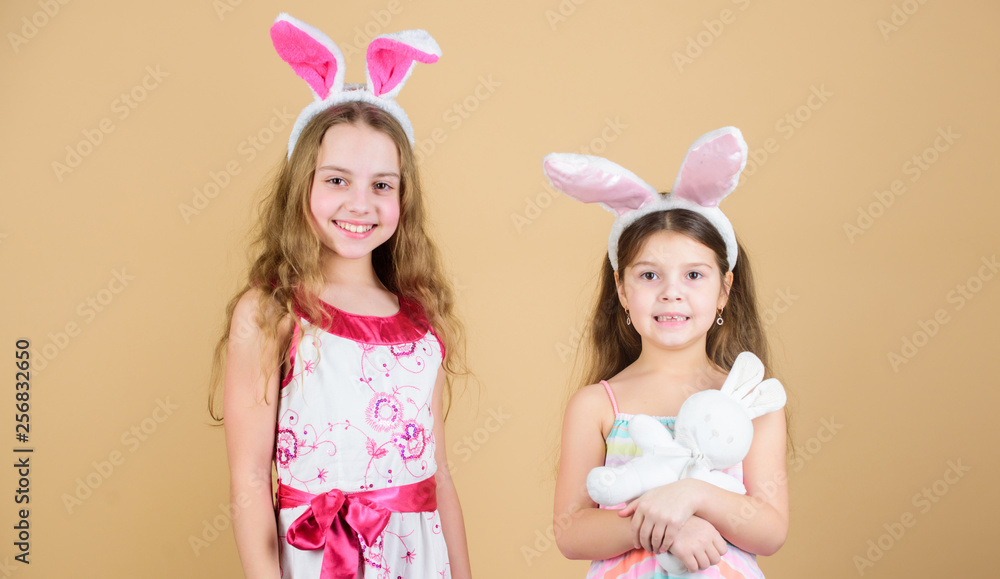 The bunny rabbits are so cute. Happy children celebrating Easter. Children in Easter bunny style holding hearts. Small children in Easter bunny headbands. Little children wearing Easter bunny ears The bunny rabbits are so cute. Happy children celebrating Easter. Children in Easter bunny style holding hearts. Small children in Easter bunny headbands. Little children wearing Easter bunny ears