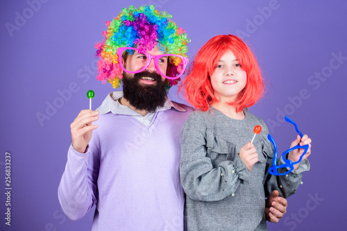 Lets get the party started. Father and daughter in party style wigs. Happy birthday. Happy family celebrating birthday. Father and girl child enjoying birthday celebration. Birthday party
