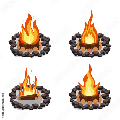 Bonfires set, burning woodpile and round of stones, campfire or fireplace on firewood