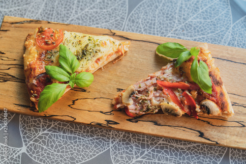 Pizza pieces upcut on a cutting board photo