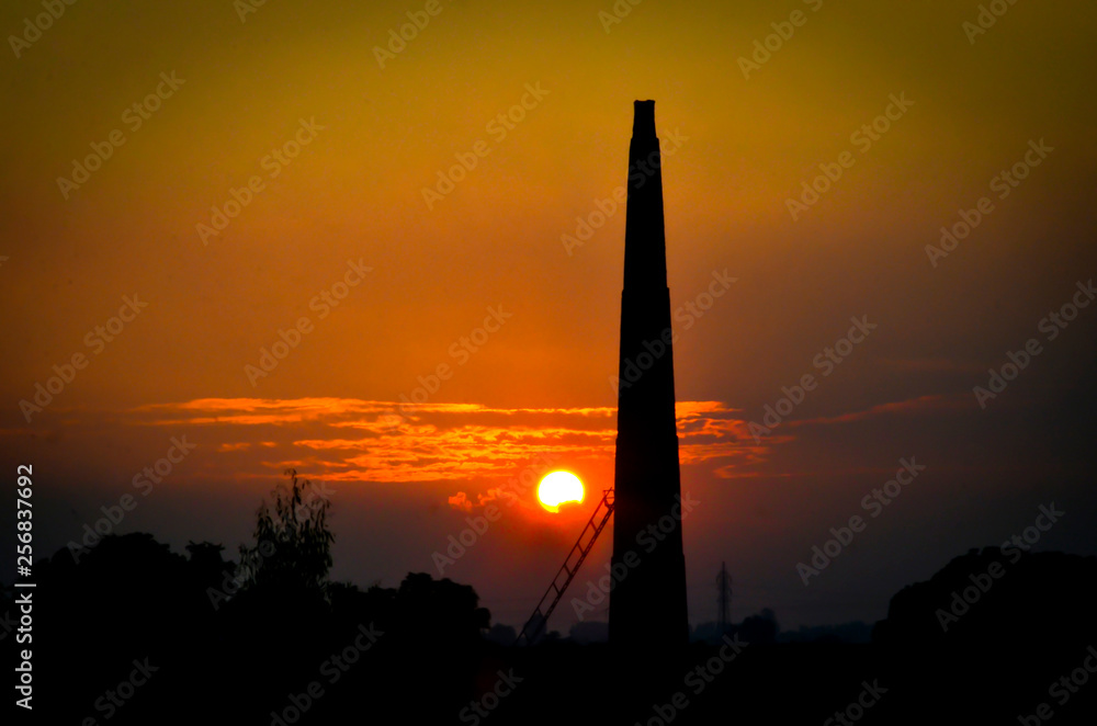 silhouette of tower at sunset