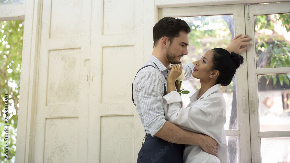 Couple standing by the window in the morning. Couple standing by the window in the morning.
