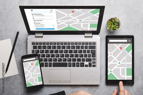 Location tracker concept on laptop, tablet and smartphone screen photo