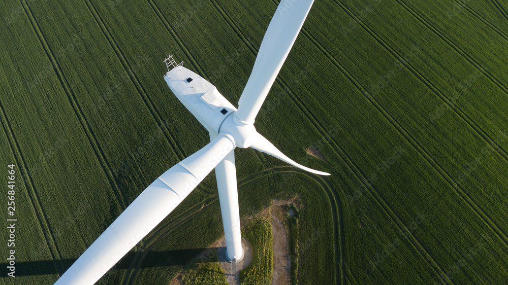 photos of wind turbines providing renewable green energy in england in the country side