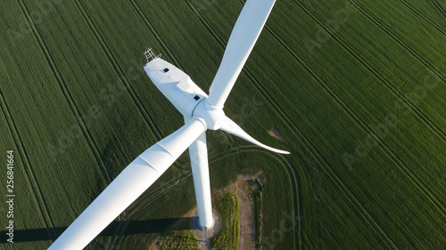 Obraz na płótnie photos of wind turbines providing renewable green energy in england in the country side w salonie