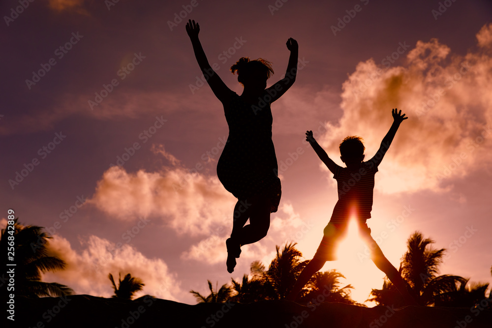 mother and son play at sunset, family enjoy tropical vacation mother and son play at sunset, family enjoy tropical vacation