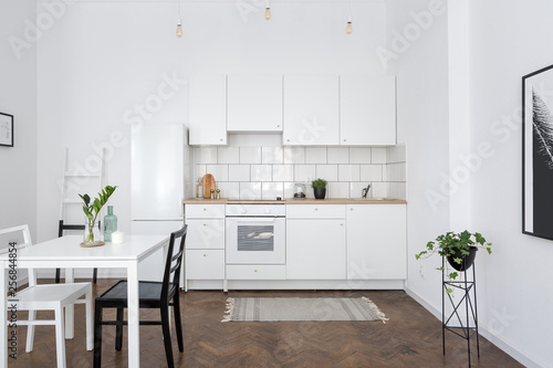 White kitchen interior with table