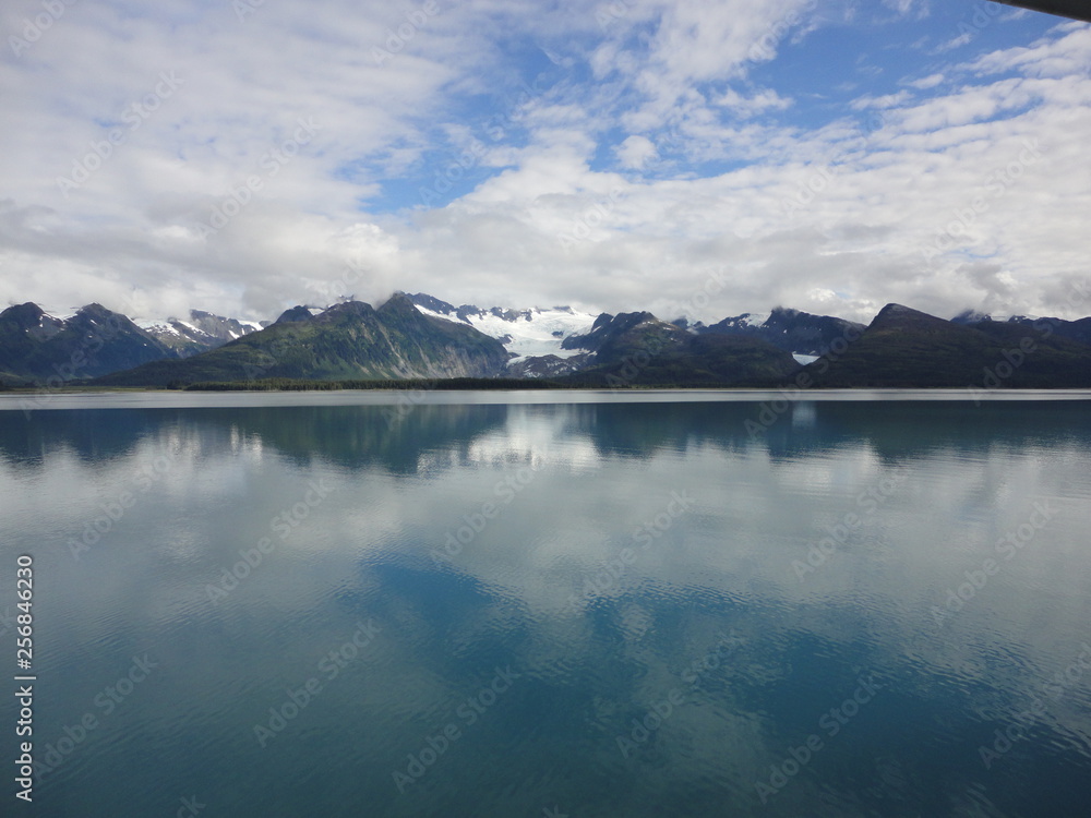 Glacier sliding between two mountains on its way to the ocean