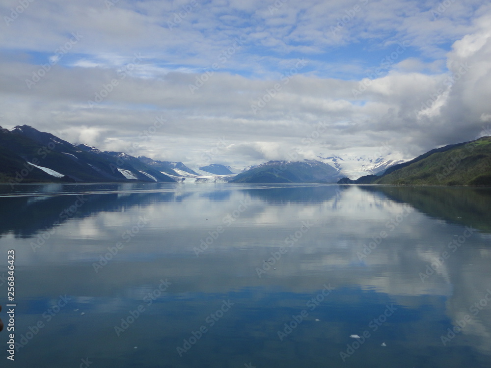 Serene Pacific Ocean with snow capped mountains and glaciers