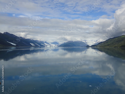 Serene Pacific Ocean with snow capped mountains and glaciers © Justin