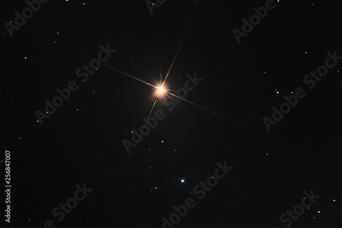 The Arcturus star in Boote constellation, called also apha Boo, taken with large diameter telescope in the dark space.