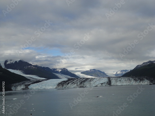 Harvard Glacier College Fjord Alaska Harvard Arm with Snow Covered Mountain Peaks and calm Pacific Ocean with Icebergs from a distance of approx 1 mile