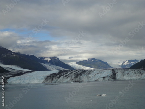 Harvard Glacier College Fjord Alaska Harvard Arm with Snow Covered Mountain Peaks and calm Pacific Ocean with Icebergs from a distance of approx 1 mile