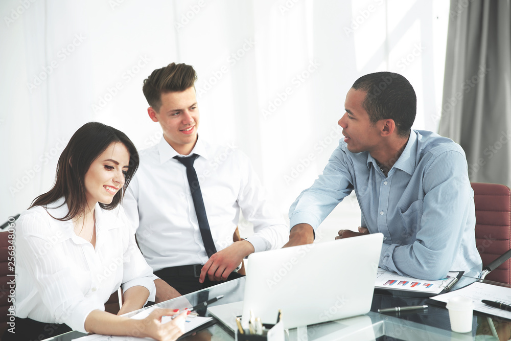 business team discussing business issues in office. business team discussing business issues in office.