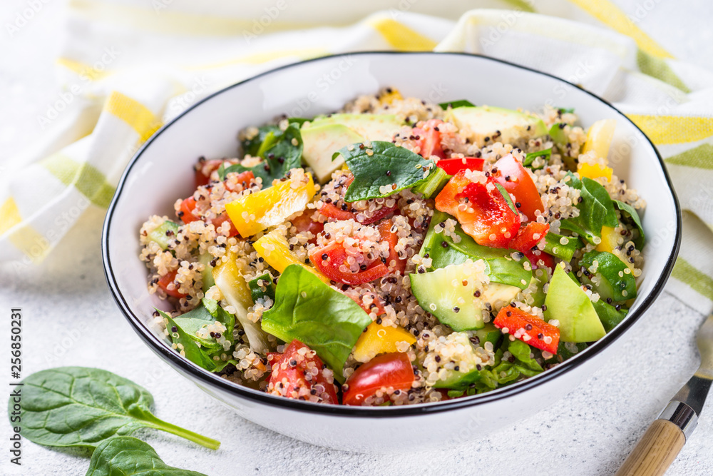 Quinoa salad with fresh vegetables on white. Quinoa salad with fresh vegetables on white.