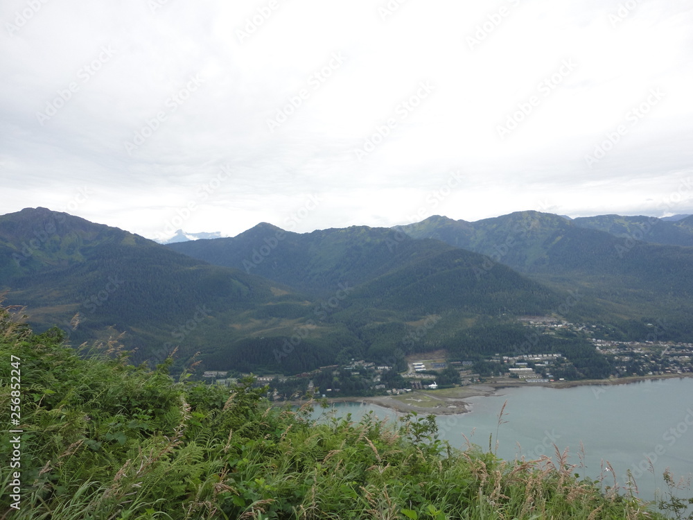 View of the inside passage from atop a mountain with the city of Juneau underneath