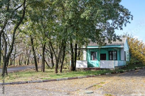 turquoise wood house in the forest