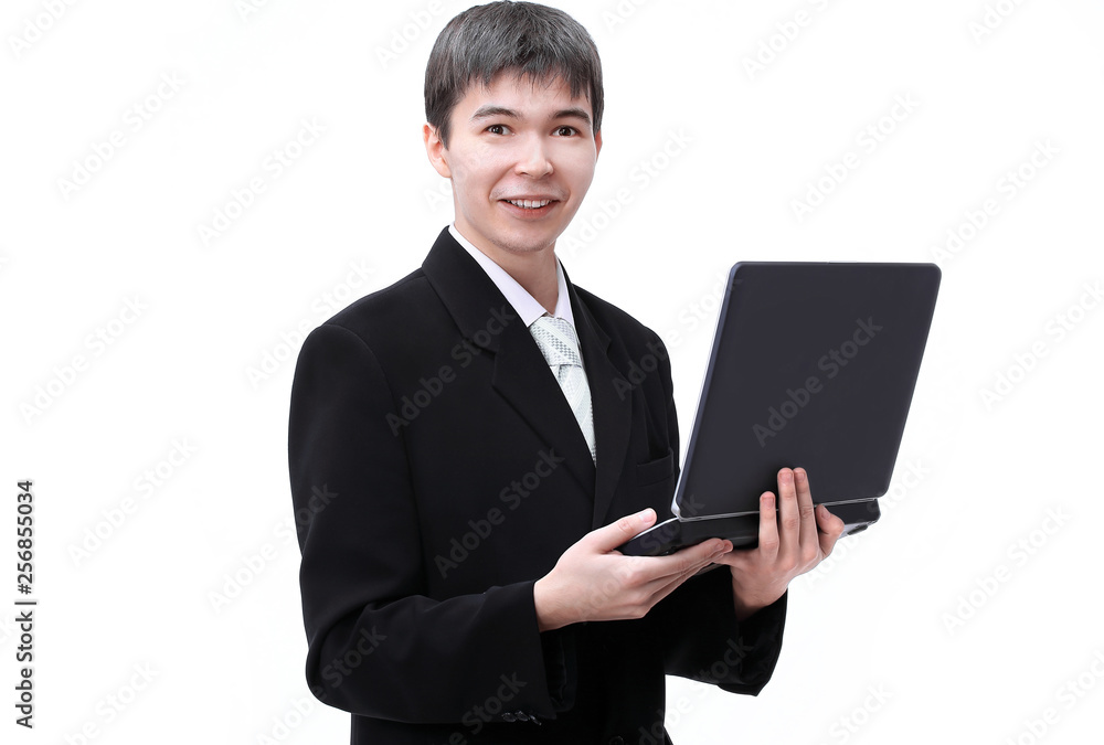 successful young businessman holding a laptop open successful young businessman holding a laptop open