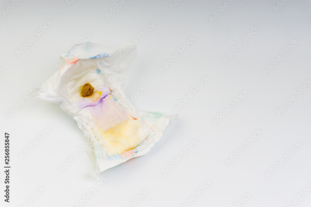 Kuala Lumpur, Malaysia - March 2, 2019 : Yellowish dirty feces of infant on diapers. Selective focus and crop fragment Kuala Lumpur, Malaysia - March 2, 2019 : Yellowish dirty feces of infant on diapers. Selective focus and crop fragment