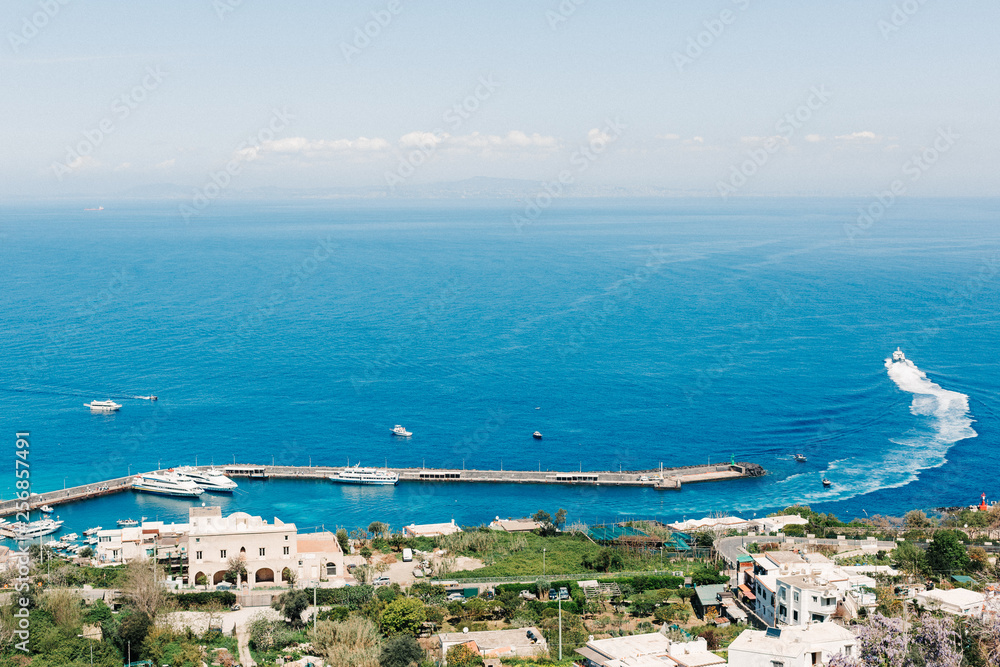 Capri coast view. Beautiful island beach with rocks Capri coast view. Beautiful island beach with rocks