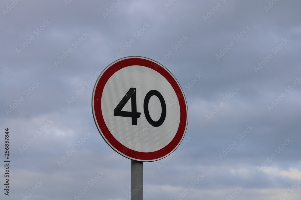 stop road sign against blue sky speed limit sign 40 kilometers Russia stop road sign against blue sky speed limit sign 40 kilometers Russia