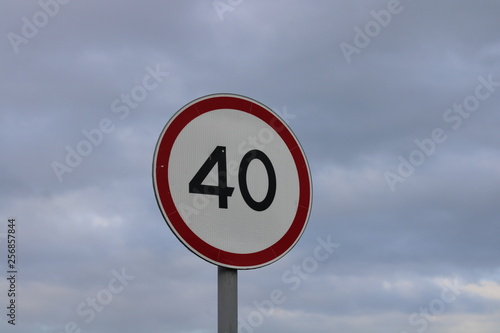 stop road sign against blue sky speed limit sign 40 kilometers Russia