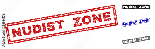 Grunge NUDIST ZONE rectangle stamp seals isolated on a white background. Rectangular seals with grunge texture in red, blue, black and gray colors.