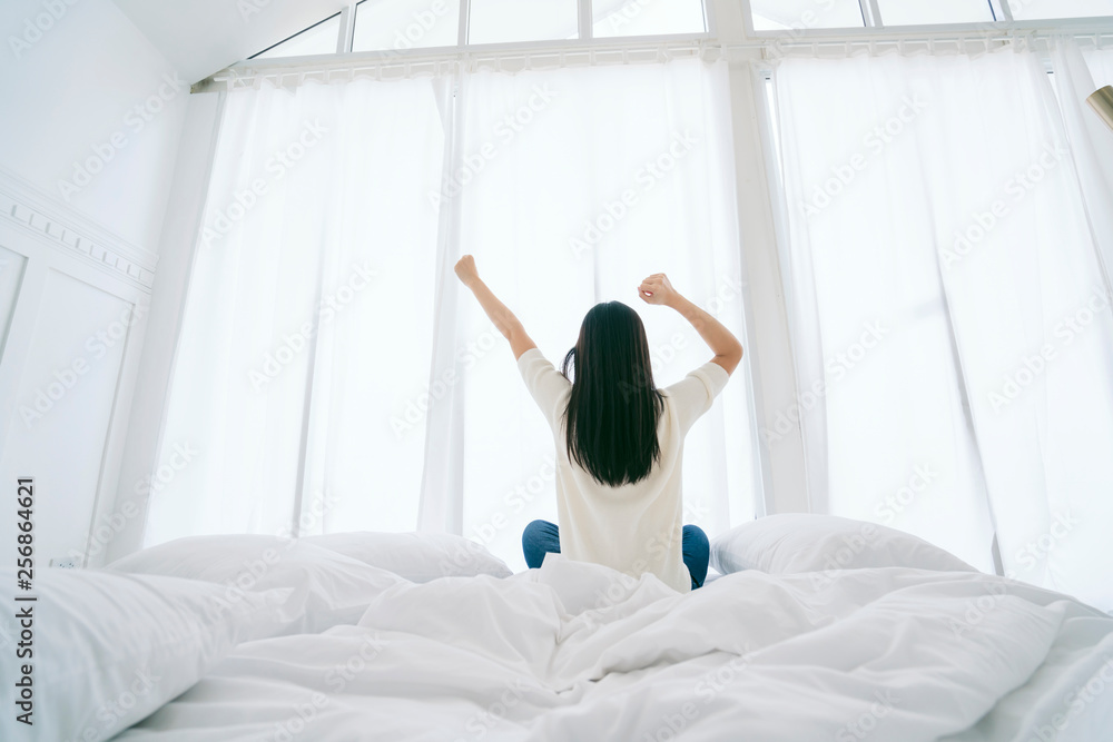 white dress asian beautiful woman stretching morning wake up bedroom with white curtain background lifestyle home concept - obrazy, fototapety, plakaty 