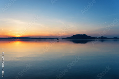 Lake Balaton after sunset with the Badacsony mountains in the background © andras_csontos