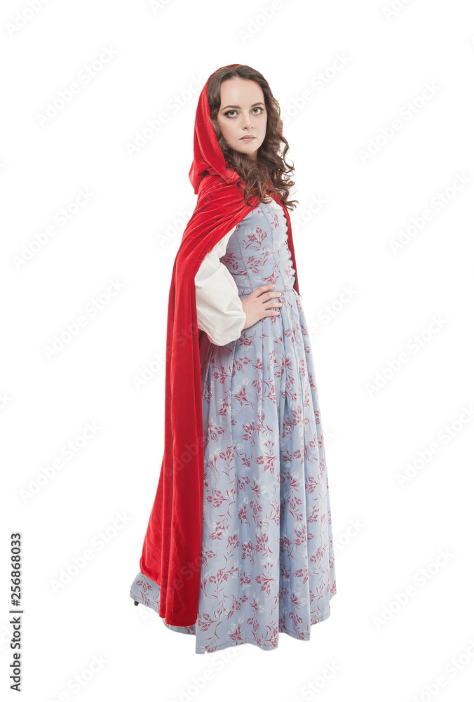 Young beautiful woman in long medieval dress and red cloak Young beautiful woman in long medieval dress and red cloak
