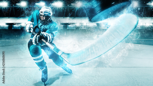 Canvas Print Ice Hockey player athlete in the helmet and gloves on stadium with stick