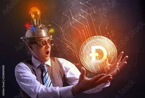 distraught looking conspiracy believer in suit with aluminum foil head with DODGECOIN cryotocurrency coin photo