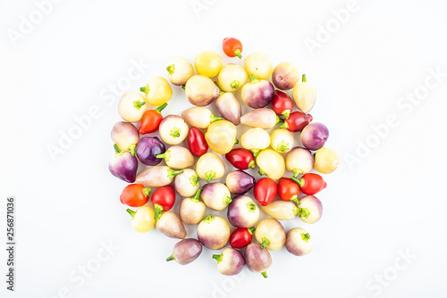 Bunch of fresh colorful peppers on white background