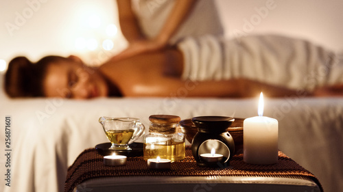 Quadro su tela Relaxed woman enjoying aromatherapy massage in luxury spa