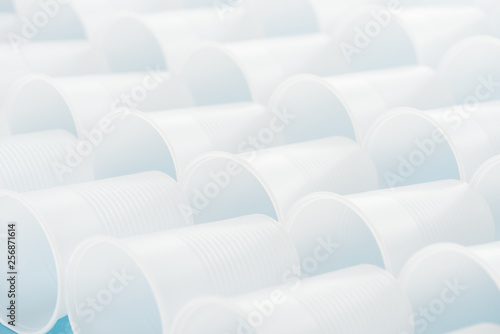 selective focus of white and plastic cups with copy space