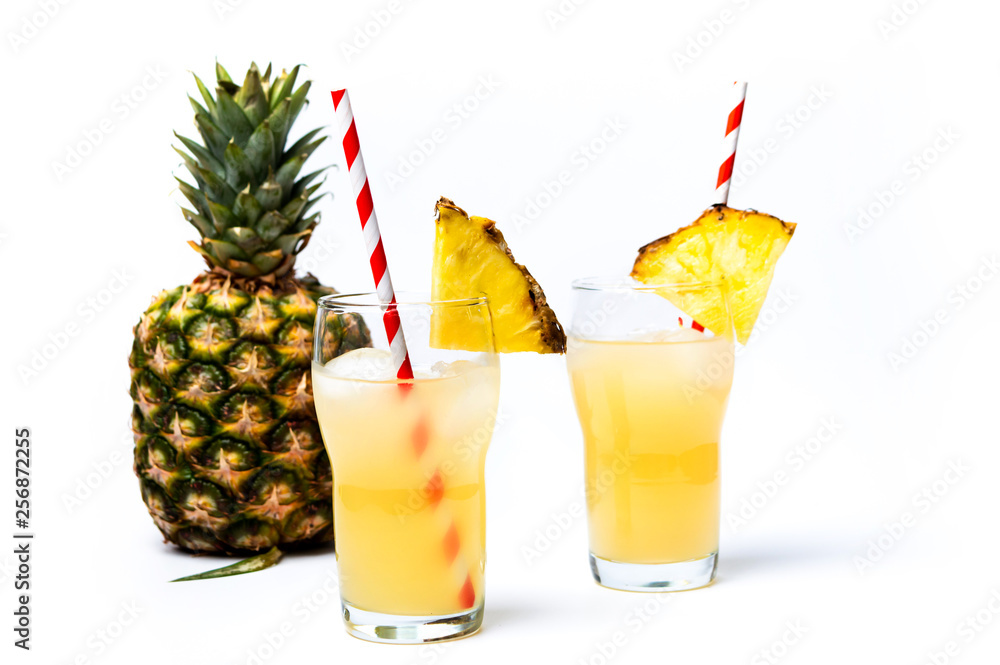 Refreshing pineapple juice in decorated glass Refreshing pineapple juice in decorated glass