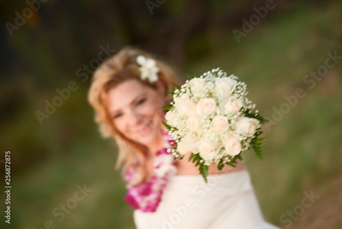 Smiling Bride holding bouquet