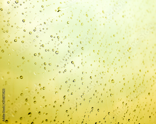 Water drops with the yellow background