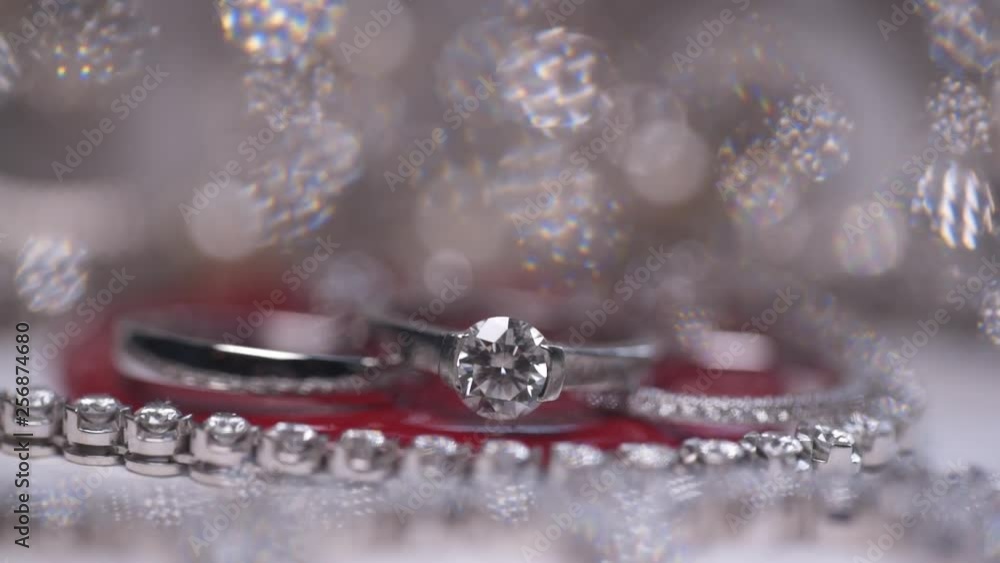 Macro shooting of engagement rings on a shiny background Macro shooting of engagement rings on a shiny background