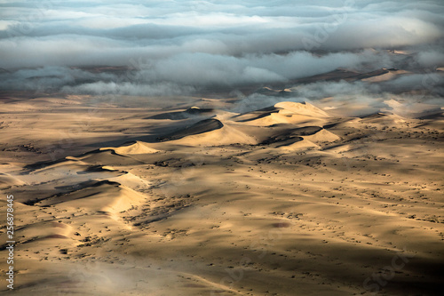 Fog over the sand sea of Sossusvlei, Namibia. photo