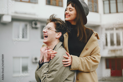 A trendy couple in a gloomy city