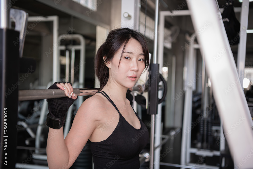 Exercise concept. A beautiful girl is exercising in the gym. Beautiful shapely girl because she plays barbell. Exercise concept. A beautiful girl is exercising in the gym. Beautiful shapely girl because she plays barbell.