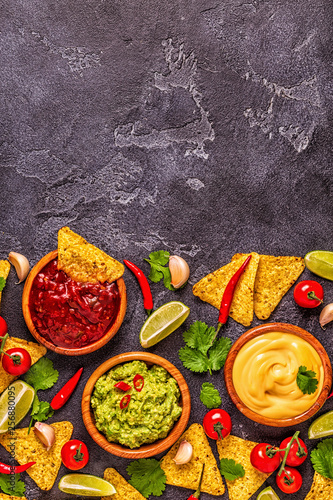 Mexican food background  guacamole  salsa  cheesy sauces
