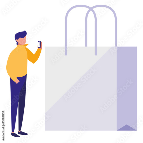 young man using smartphone with shopping bag