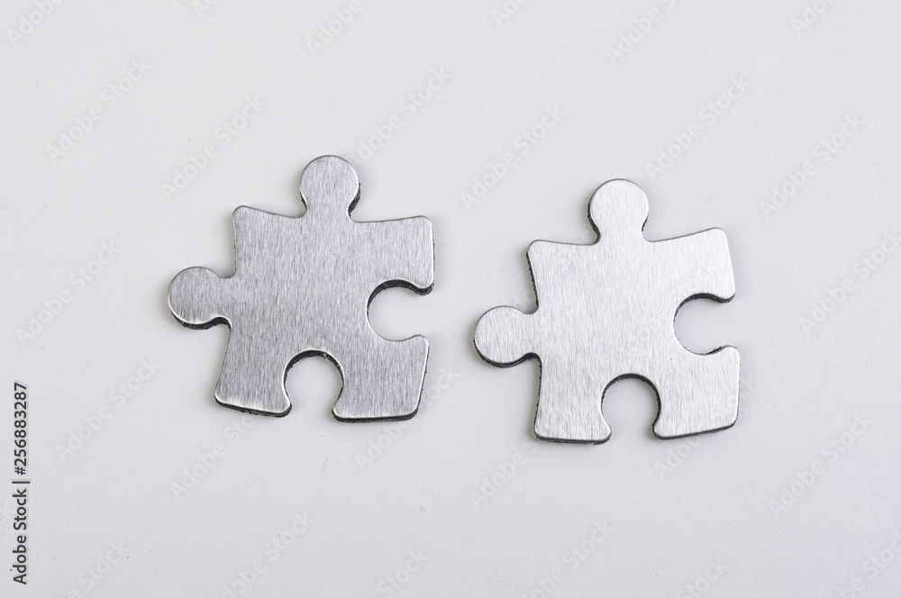 metal puzzle on a white background metal puzzle on a white background